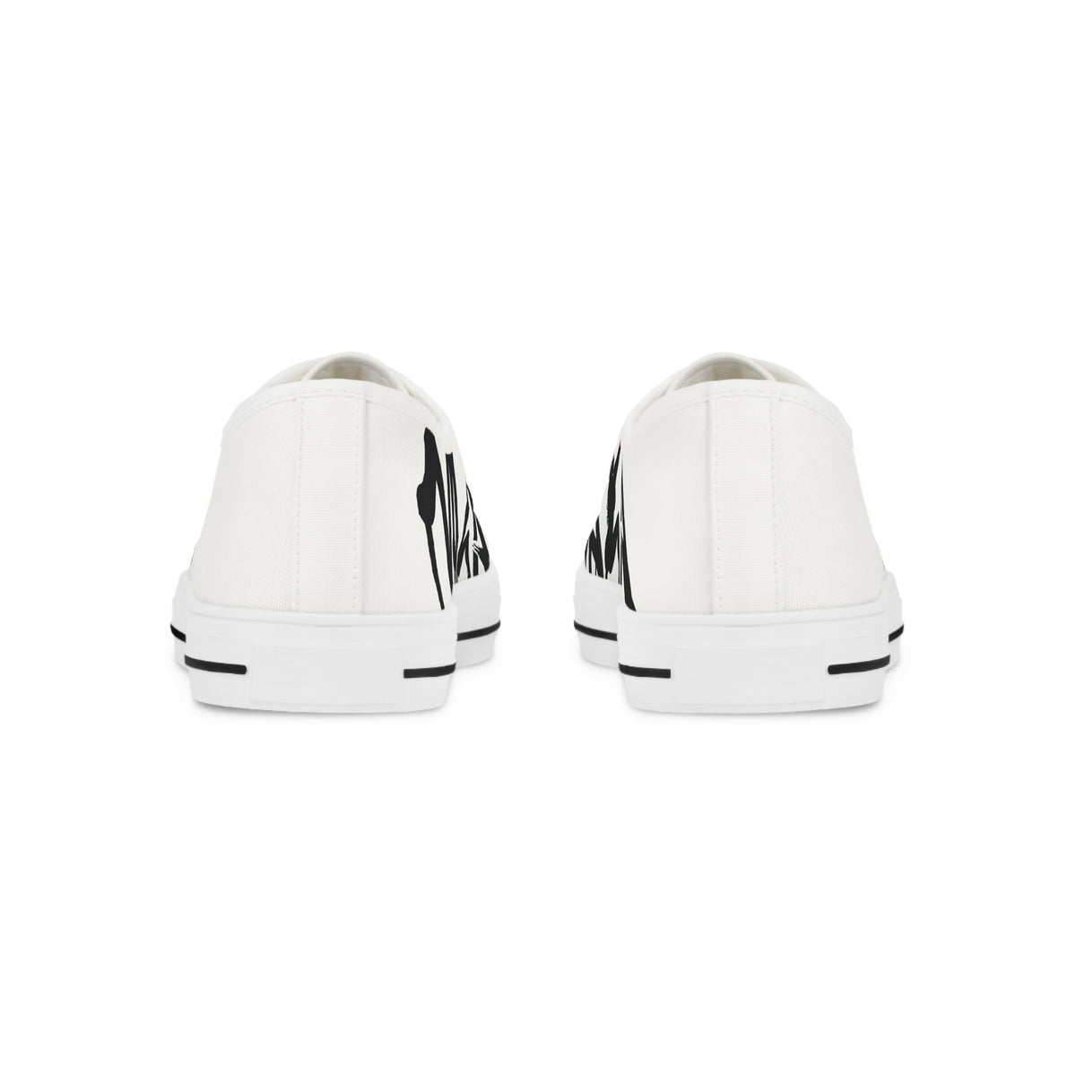 A pair of white low-top canvas sneakers shown from the back, featuring a bold black graphic print on the heel and a black stripe detail on the white rubber sole.