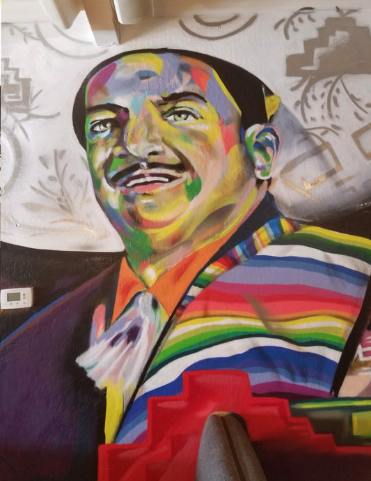 Colorful portrait of a person with a rainbow pattern on a textured surface