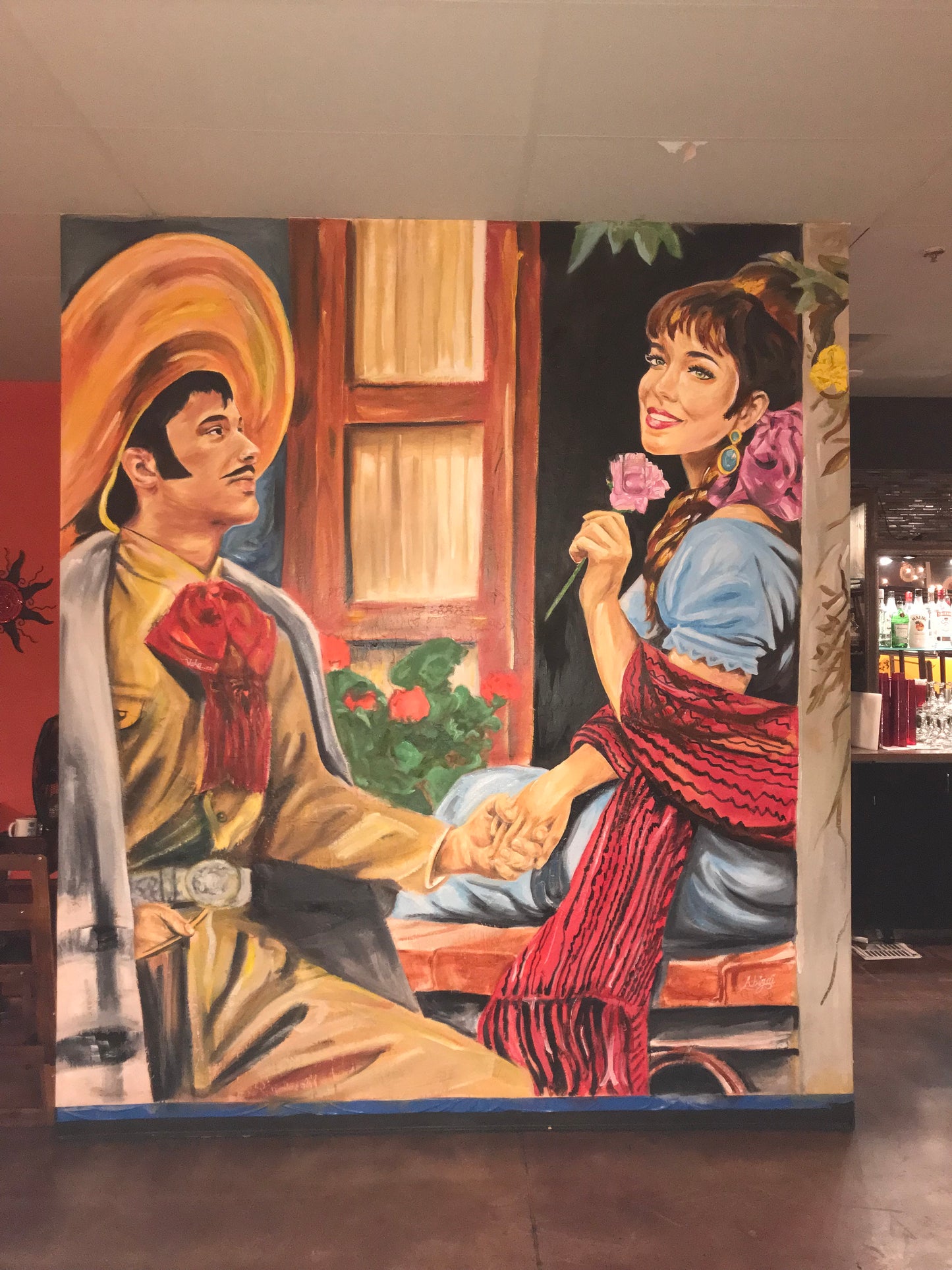 A deposit for a custom graffiti mural service, showing a painted mural of two people in traditional clothing.