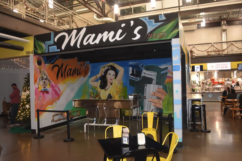 Mami's food truck with colorful graphics in a food court setting