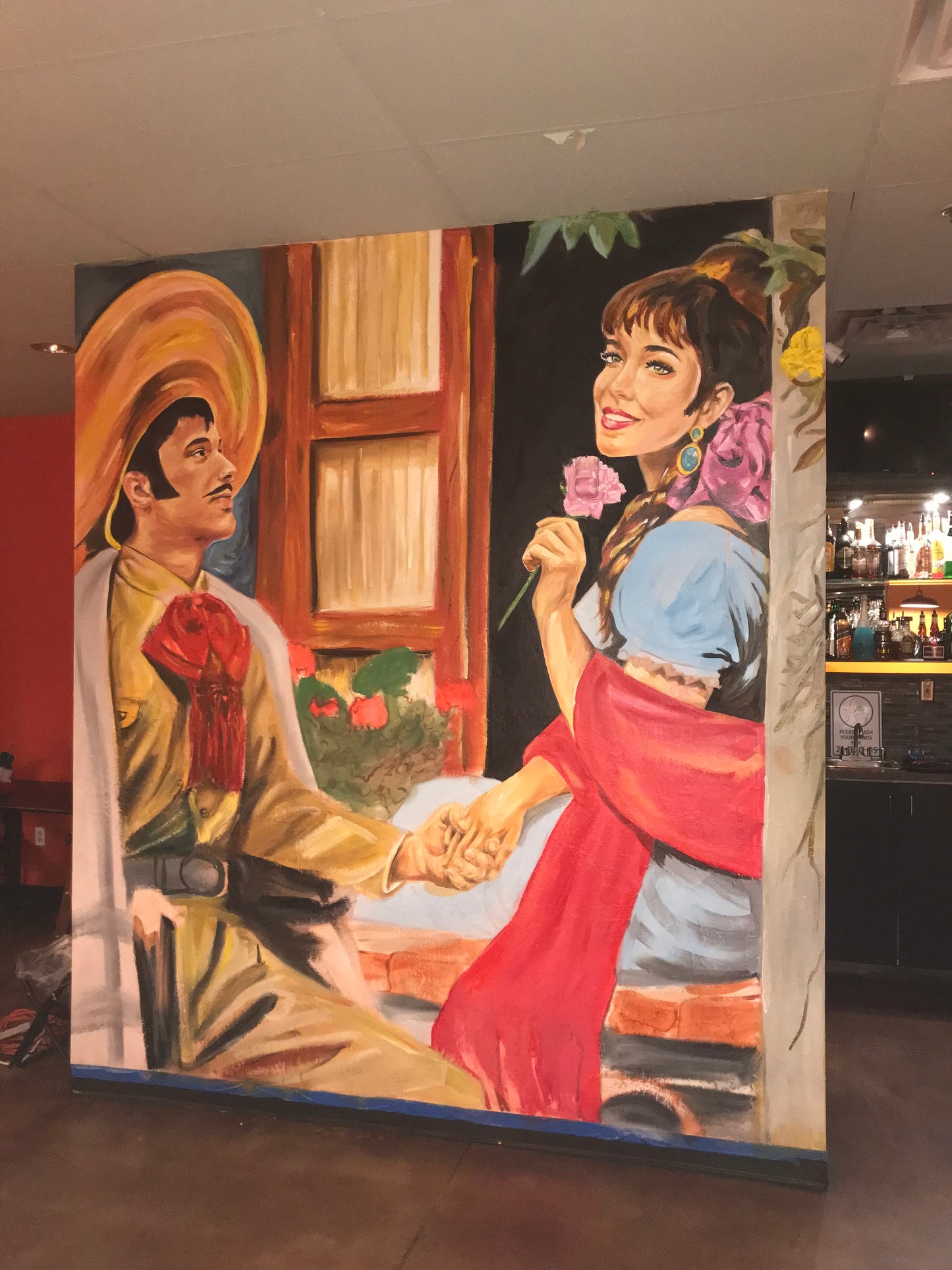 Painting of a woman with another person, possibly in a religious or historical context, displayed indoors.