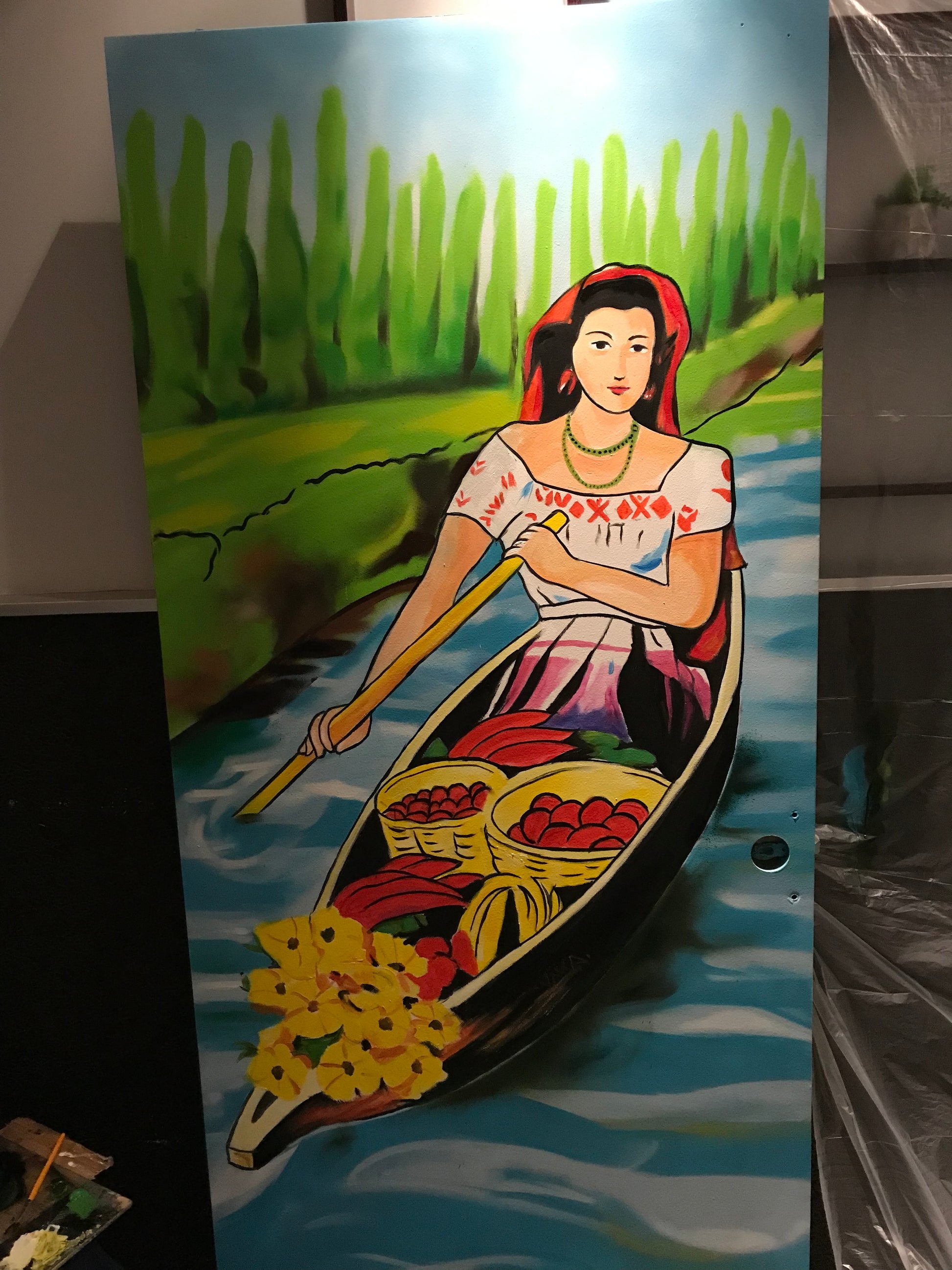 Colorful artwork of a woman with a fish on a blue background
